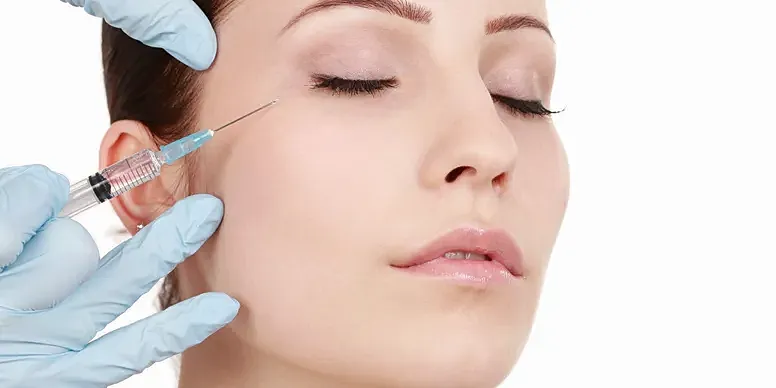 Woman receiving cosmetic injection treatment.