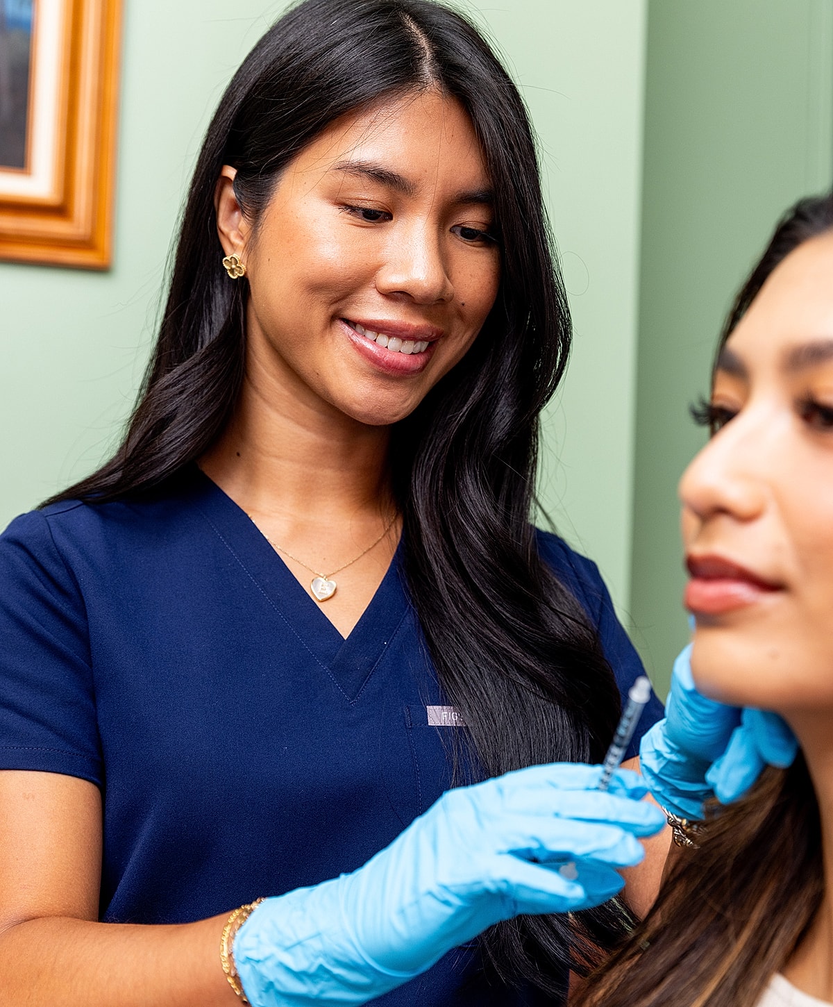 Woman smiling in sunset by the beach.