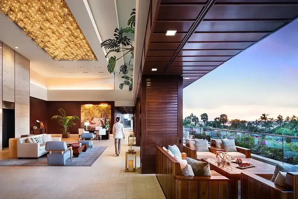 Elegant hotel lobby with scenic outdoor view.