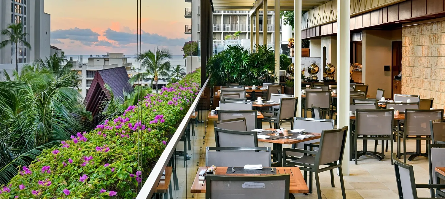Cozy sitting area with plants and soft lighting.