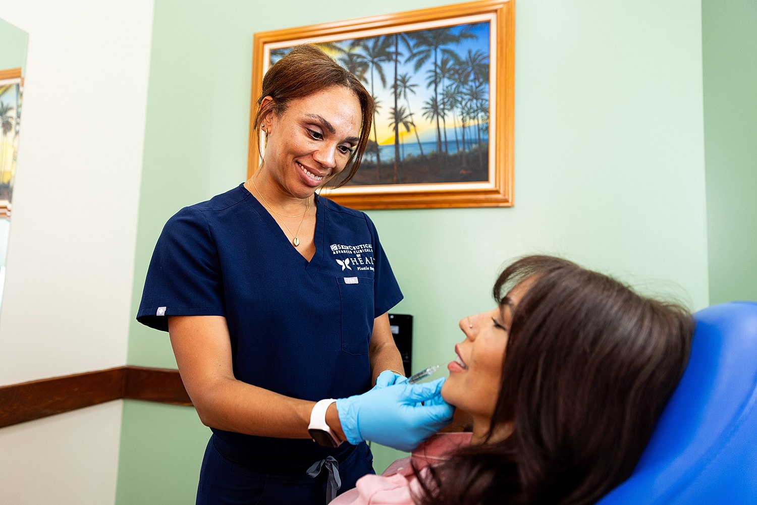 Patient receiving dental care from smiling professional.