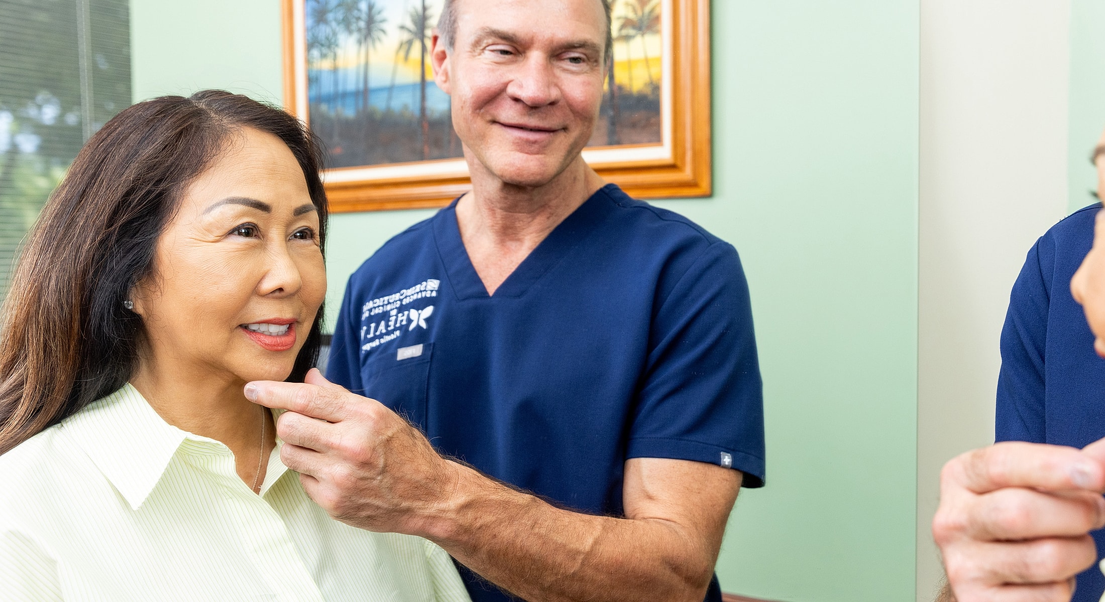 Smiling woman with long blonde hair indoors.